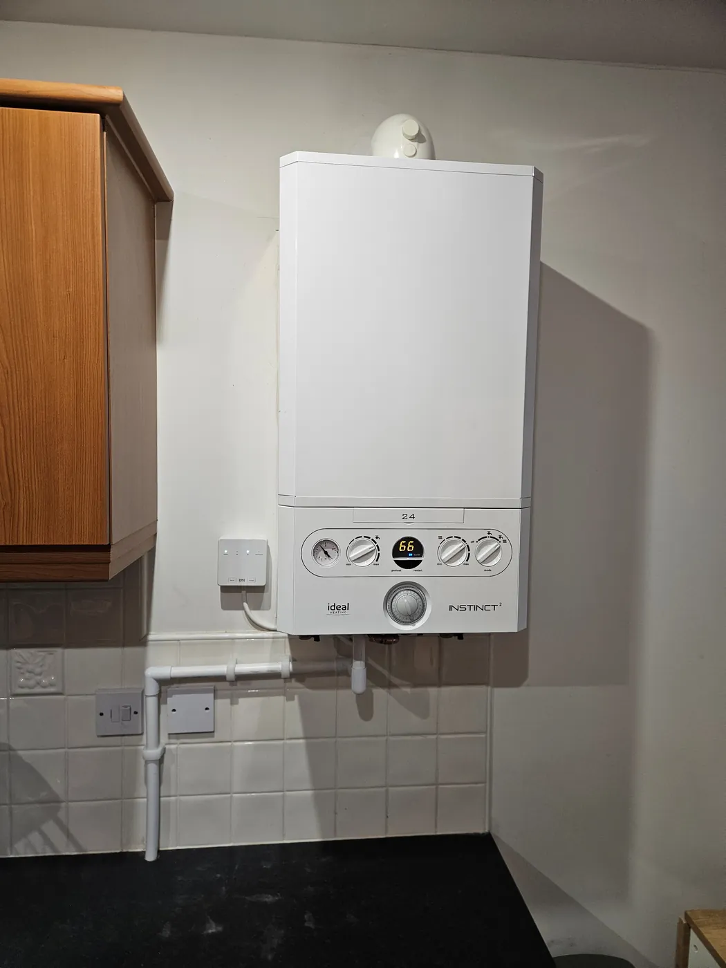 Wall-mounted boiler in a kitchen